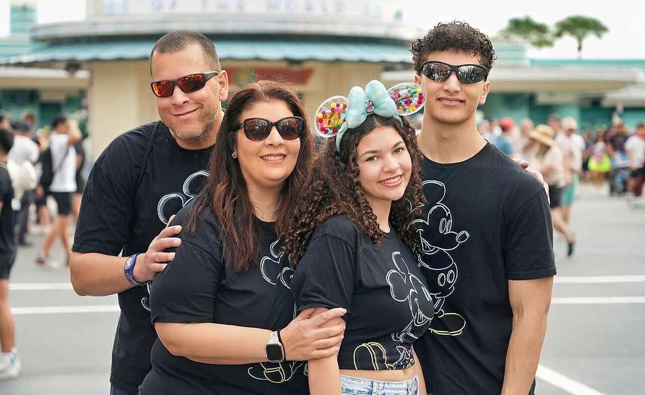 A family wearing the Mickey & Friends Collection together