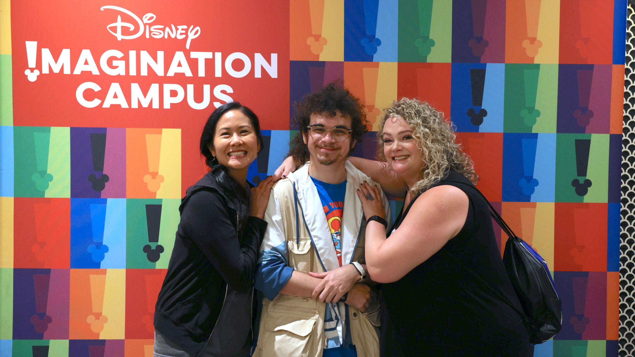 Mouseketeer mentoring a young student through the Mentoring & Youth Arts Education program