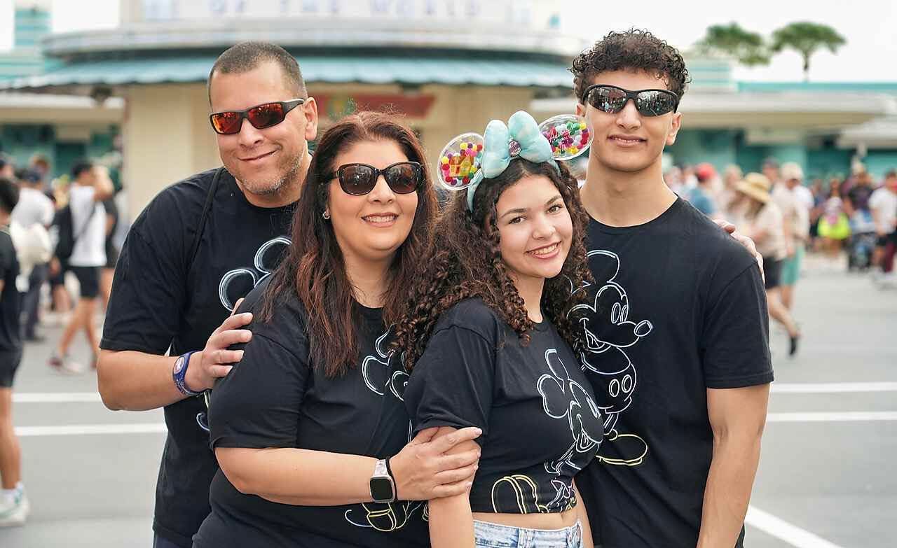 A family wearing the Mickey & Friends Collection together